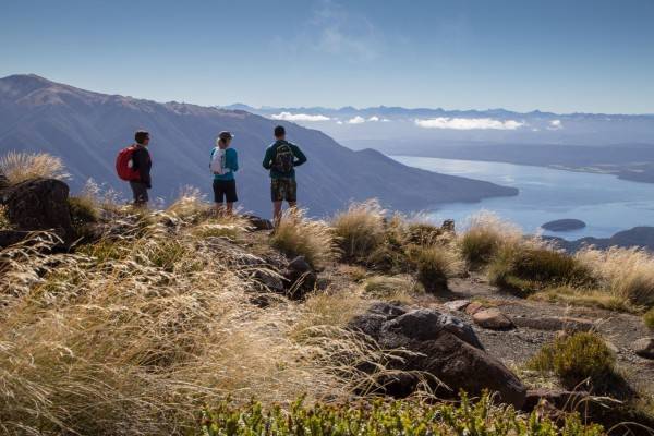 Kepler Heli Hike on trail with couple admiring the view|Trips and Tramps